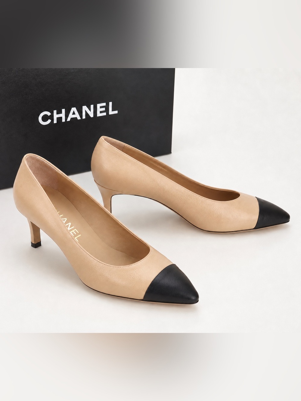 CHANEL Two-Tone Pointed-Toe Leather Pumps — Beige with Black Cap Toe